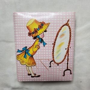Vintage Mini Photo Album. Pink with Girl looking into a mirror.